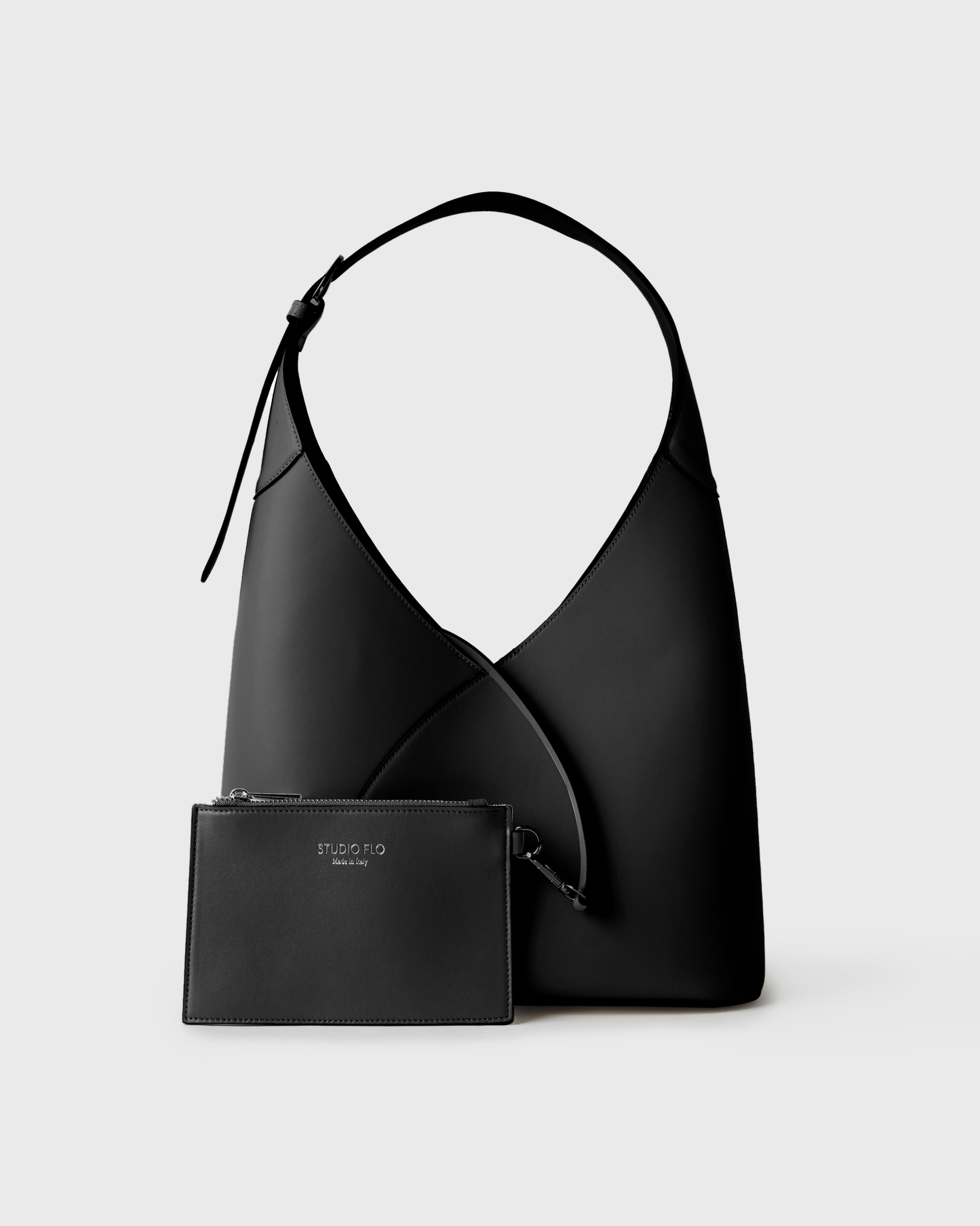 Black calfskin crescent hobo bag with modern, minimalist shape