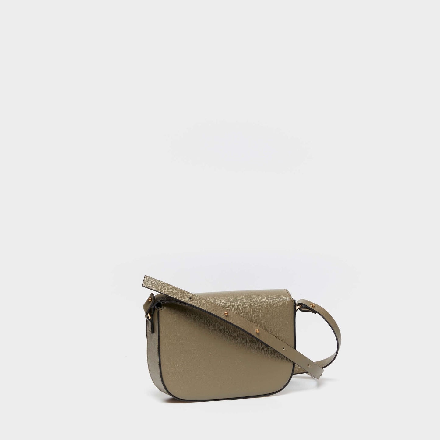 Side view of structured beige leather crossbody bag with adjustable strap