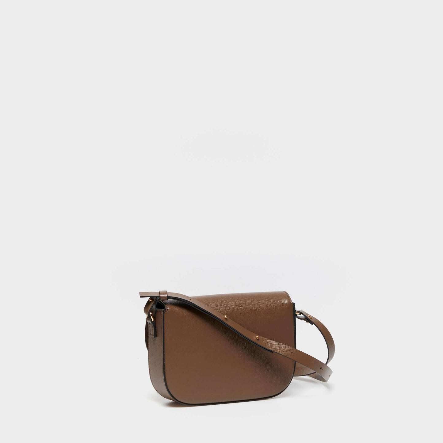 Side view of structured taupe leather crossbody bag with adjustable strap