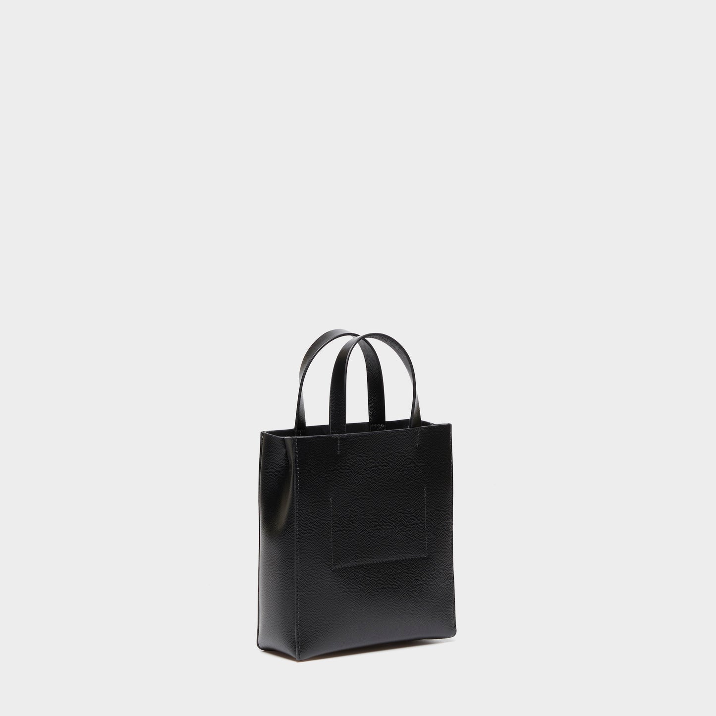 Side view of black leather mini shopper bag with clean silhouette