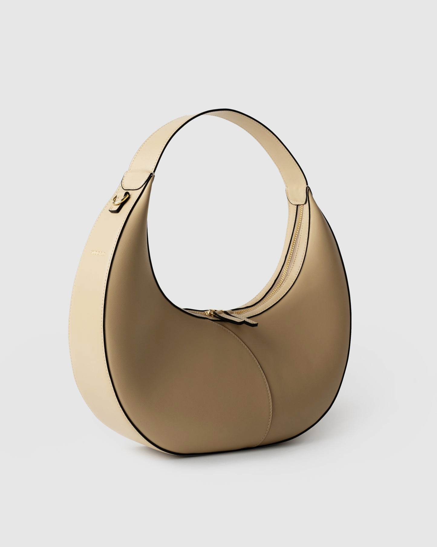 Side view of structured shoulder bag in cream leather