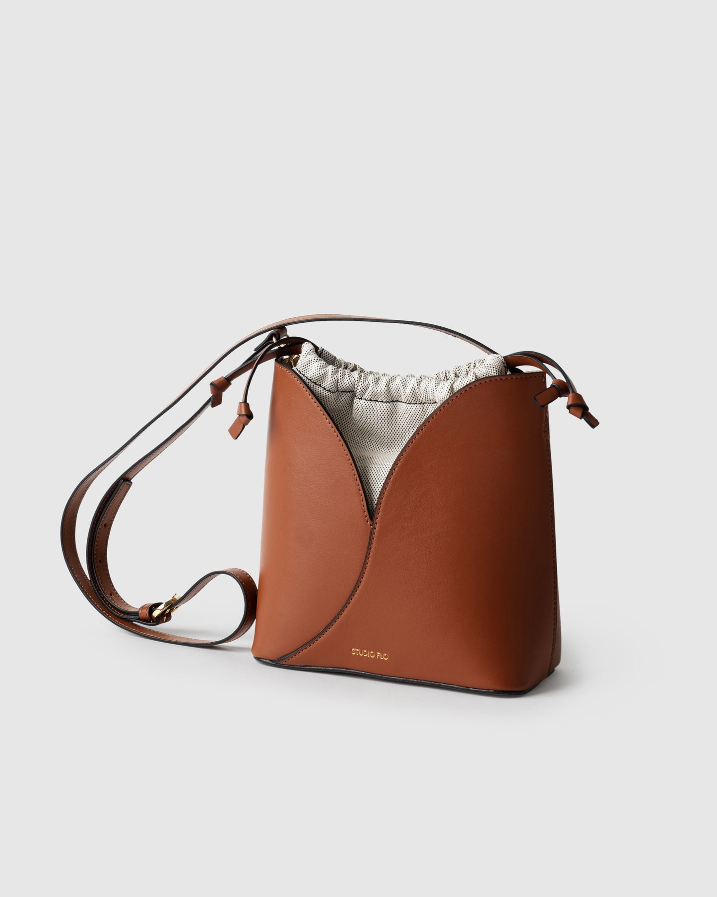 Italian calf leather bucket bag with adjustable strap and top handle