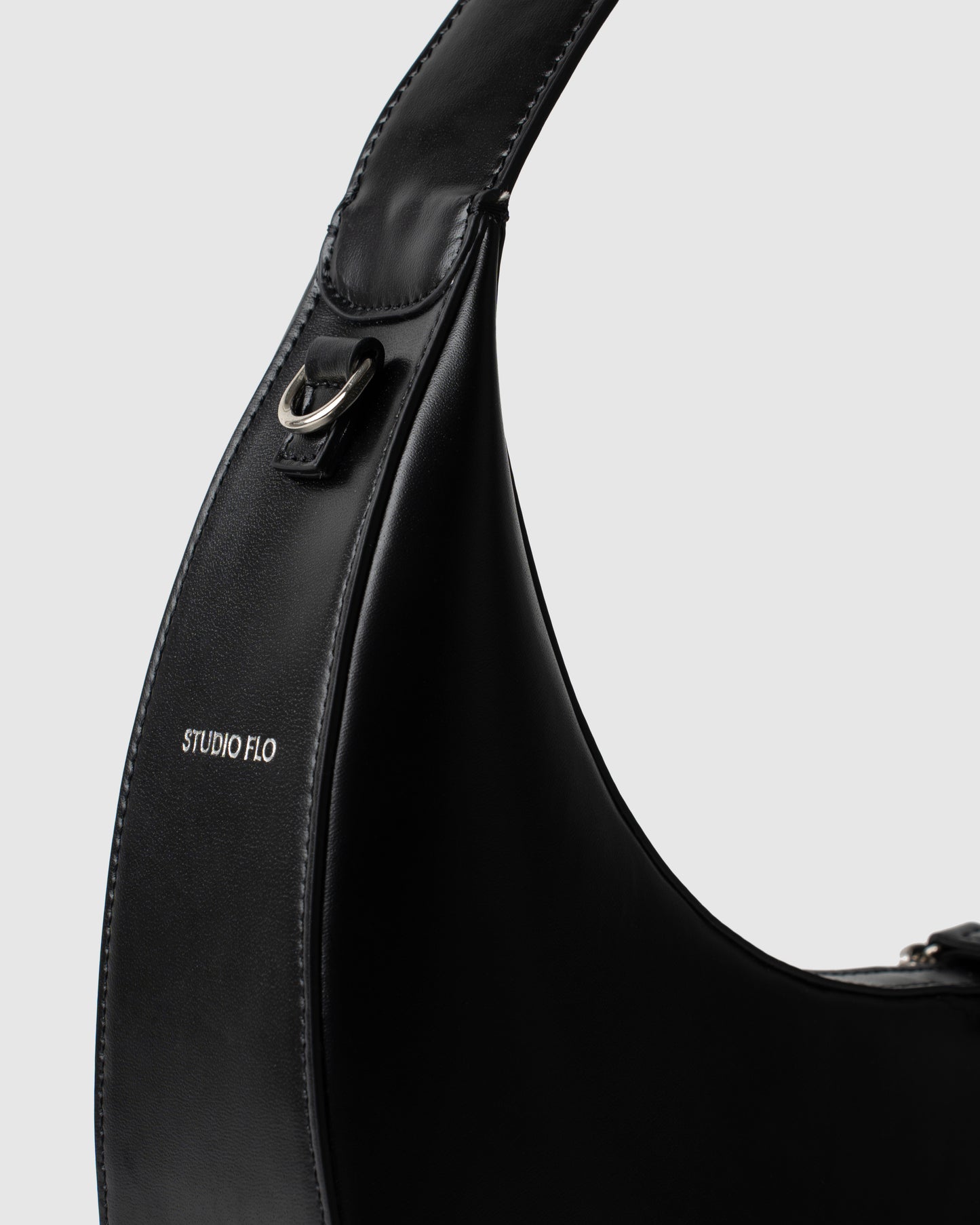 Studio Flo Logo on Moon Loop Black Leather bag