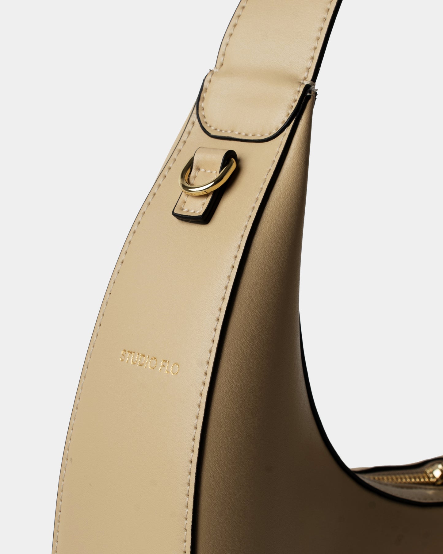 Moon Loop in cream with adjustable strap and refined silhouette