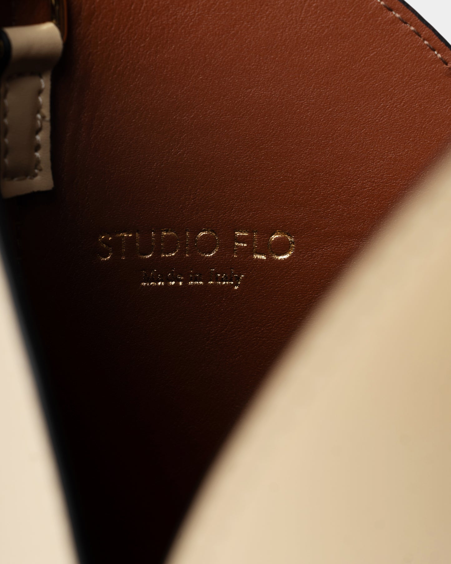 Interior view of cream bucket bag with double-layered construction and pouch
