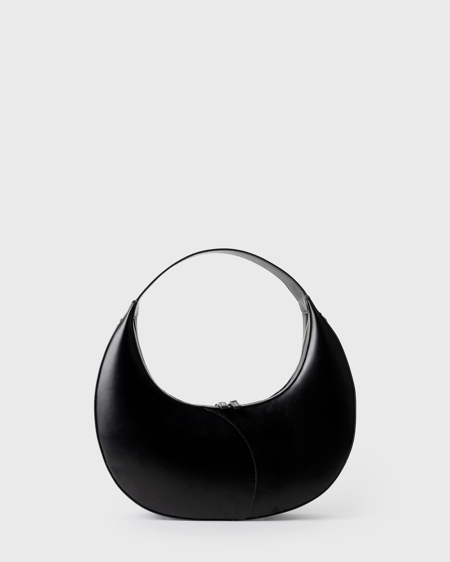 Big crescent-shaped shoulder bag in black calf leather with curved handle