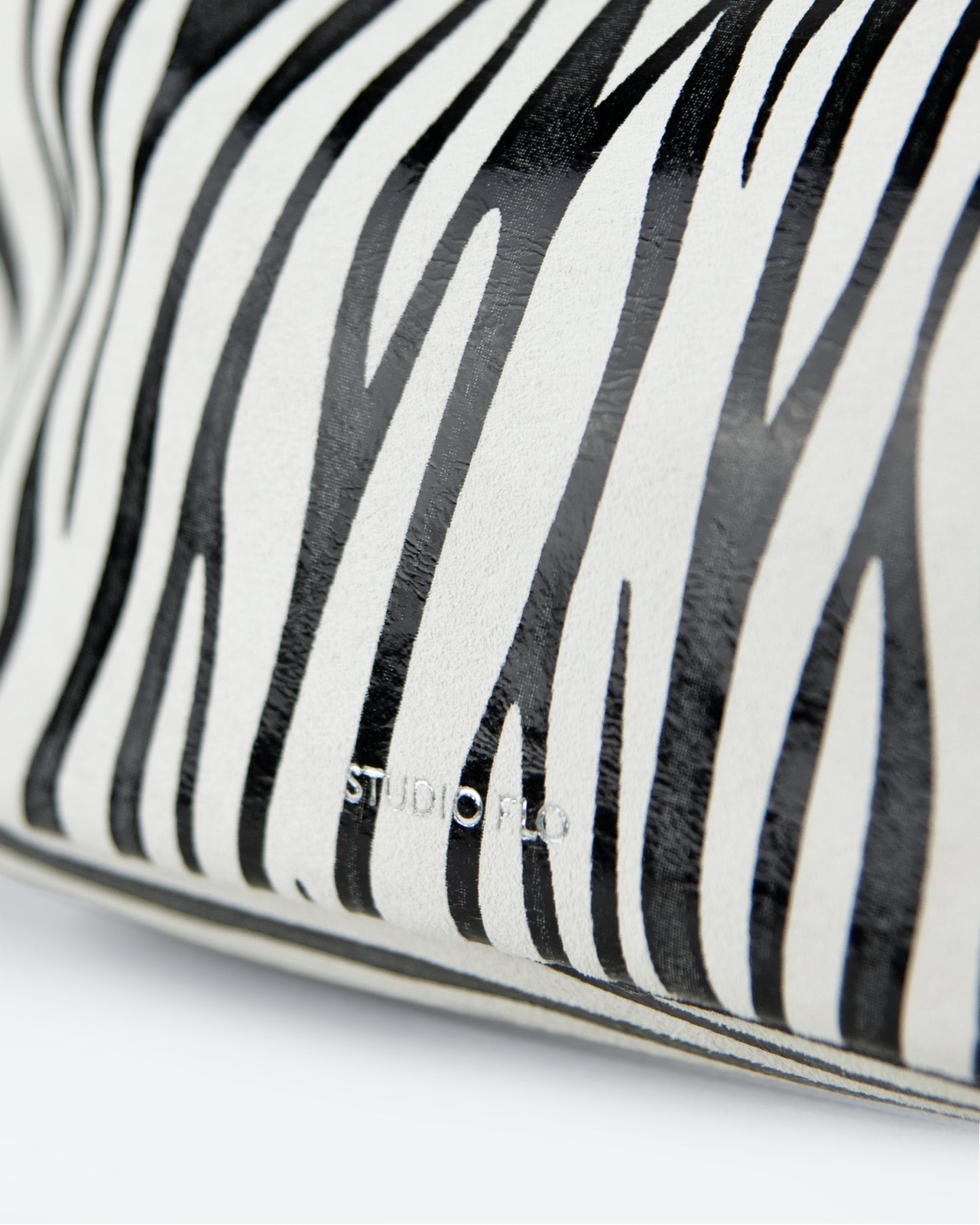 closeup of zebra leather pouch, made in italy