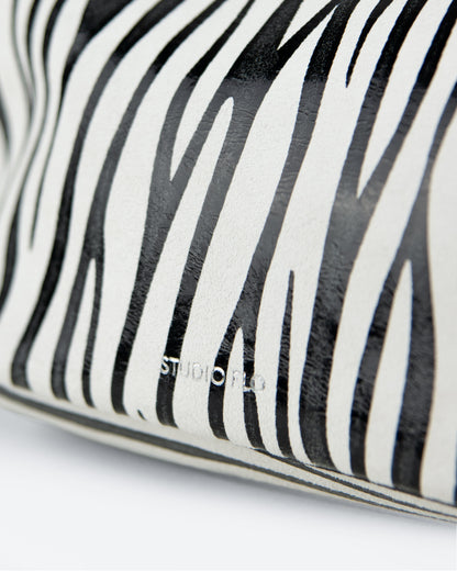 closeup of zebra leather pouch, made in italy
