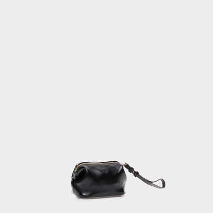Compact black leather pouch with detachable strap and zip closure