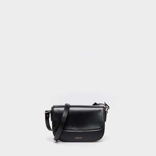 Beige calfskin leather crossbody bag with curved silhouette