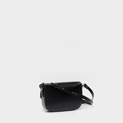 Side view of structured leather crossbody bag with adjustable strap