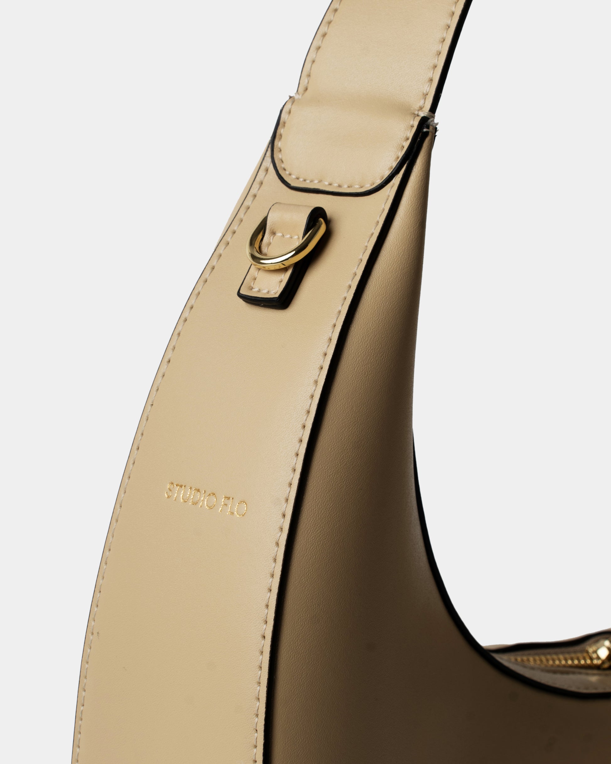 Moon Loop in cream with adjustable strap and refined silhouette