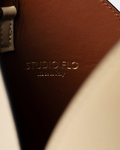 Interior view of cream bucket bag with double-layered construction and pouch