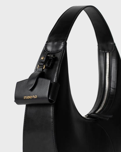 Moon Loop in black with adjustable strap and refined silhouette with Airpods Case Charm