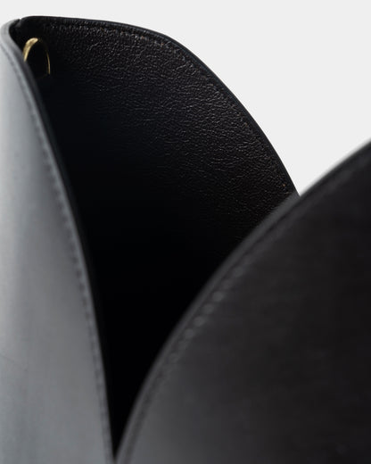 Interior detail of black leather bucket bag with removable pouch