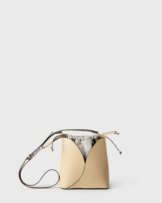 Compact bucket bag in cream calf leather with curved top and handle