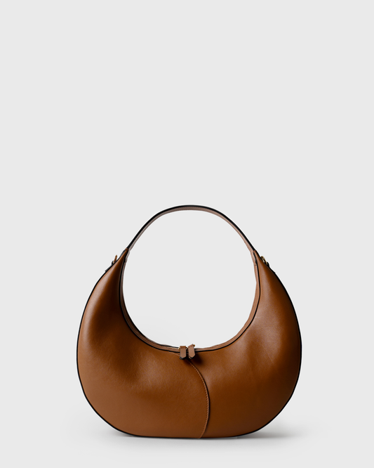 Big crescent-shaped shoulder bag in cognac calf leather with curved handle