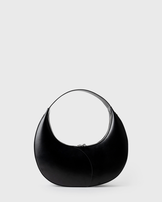 Big crescent-shaped shoulder bag in black calf leather with curved handle