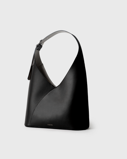 Minimalist black hobo bag in calfskin with crescent silhouette
