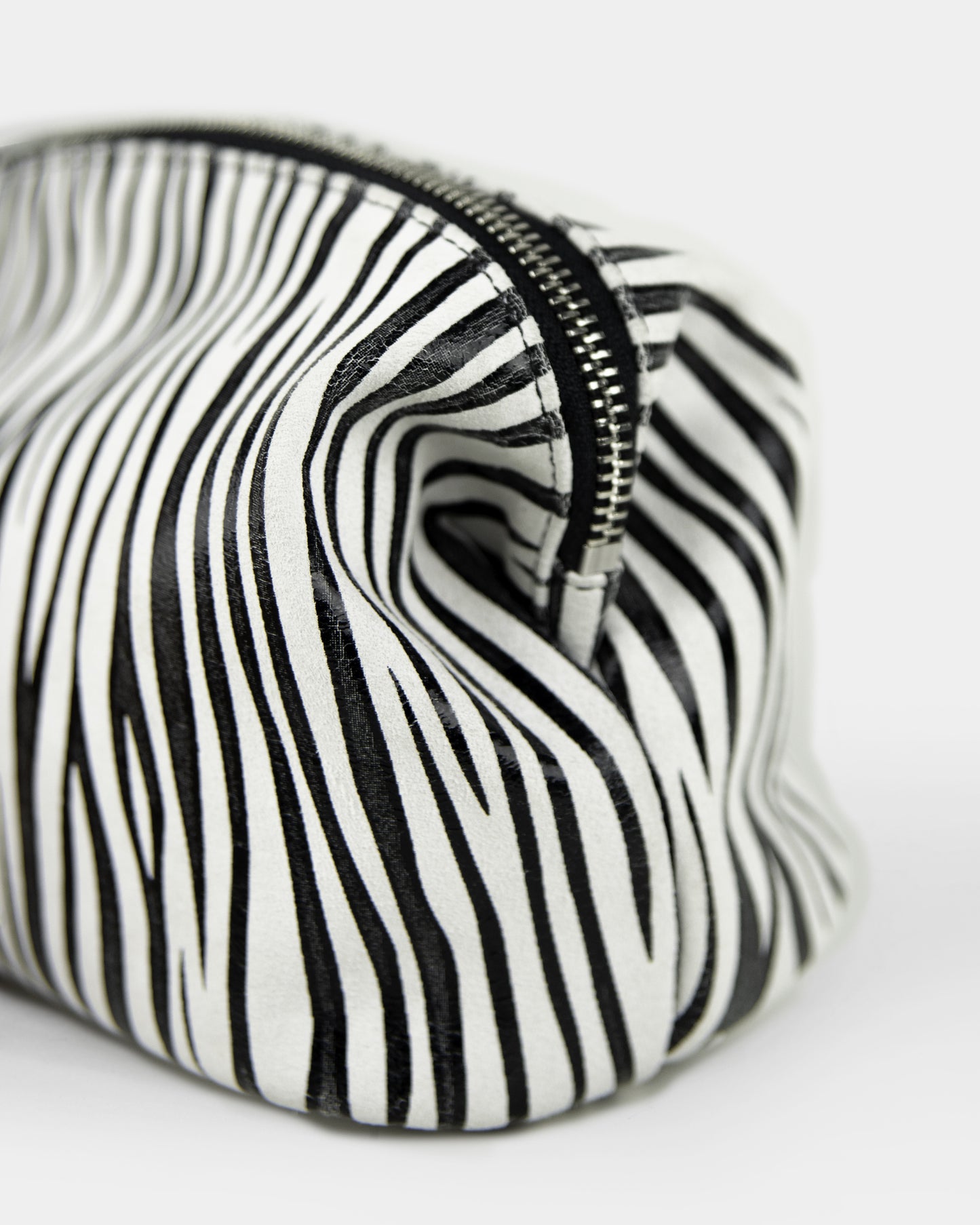 closeup of zebra leather pouch, made in italy