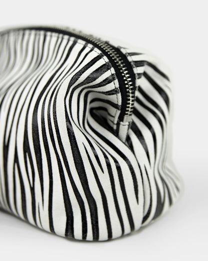 closeup of zebra leather pouch, made in italy