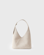 Sinué — Schultertasche aus Veloursleder — beige