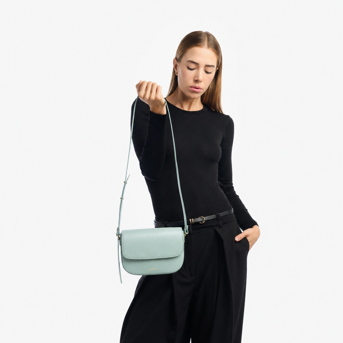 Minimalist mint green Italian leather crossbody bag worn